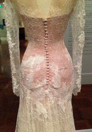 Detail of white lace dress designed by Paul Vasileff and manufactured by Paolo Sebastian in 2013