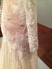 Detail of white lace dress by Paul Vasileff and Paolo Sebastian