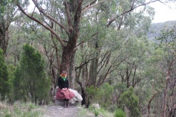 Amy Dale, sitting on a rock in Cleland Conservation Park